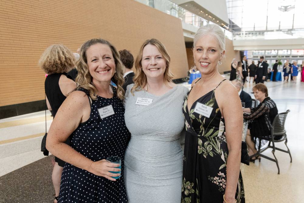 Three guests smiling and enjoying Enrichment
